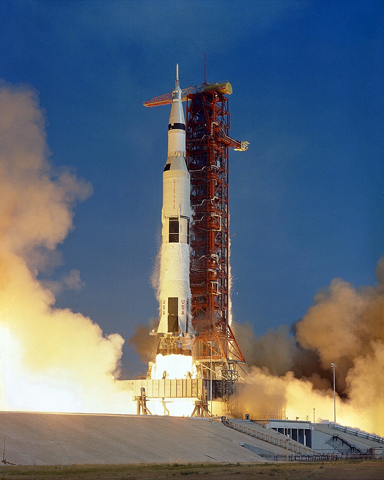 Saturn V carrying Apollo 11 climbs past the launch tower, July 16, 1969